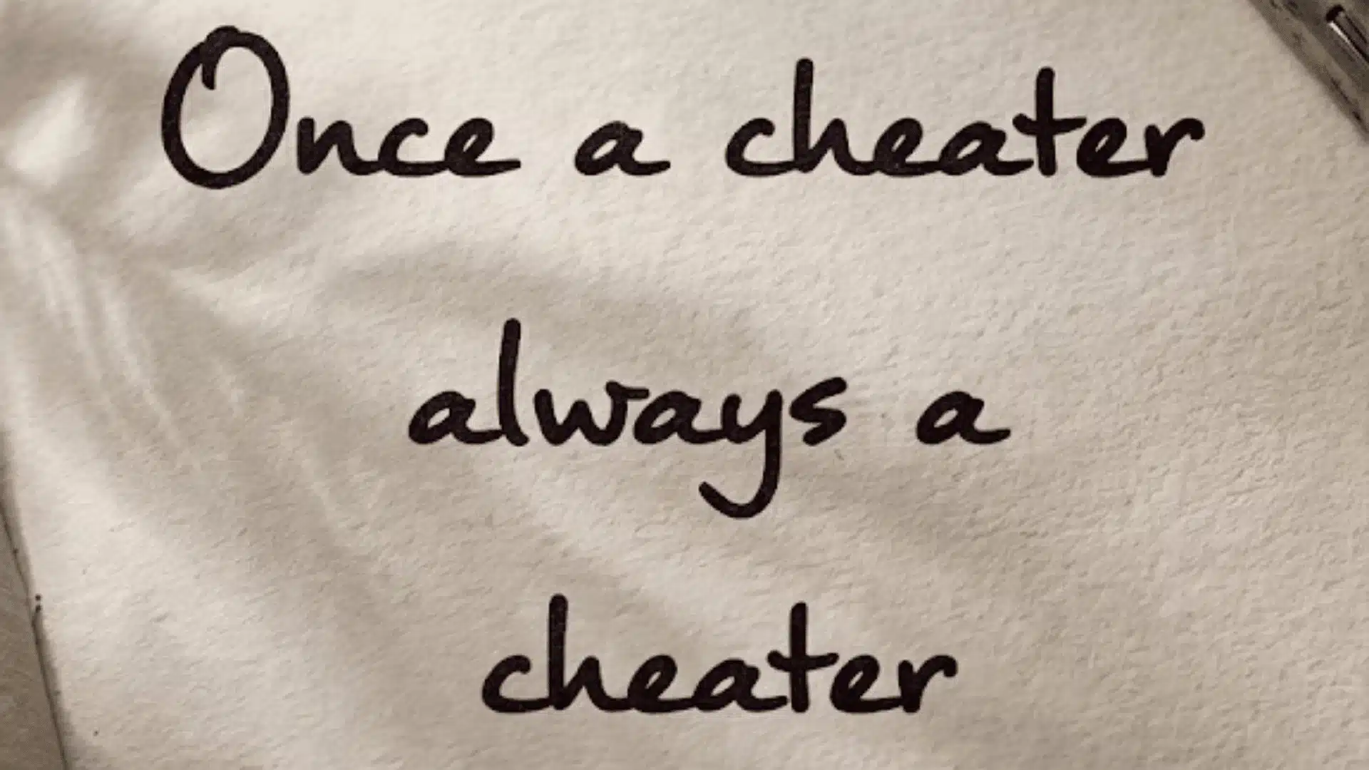 handwritten quote 'Once a cheater always a cheater' on a vintage textured paper background