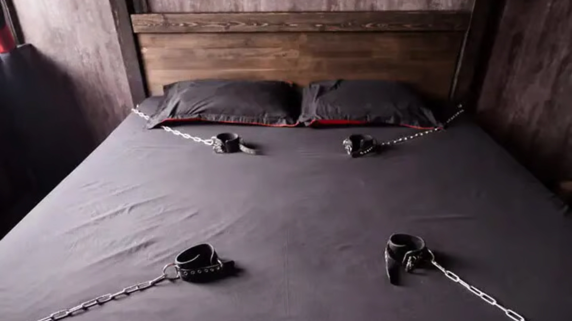 An image of a restraint bed with cuffs on all the four sides of the bed